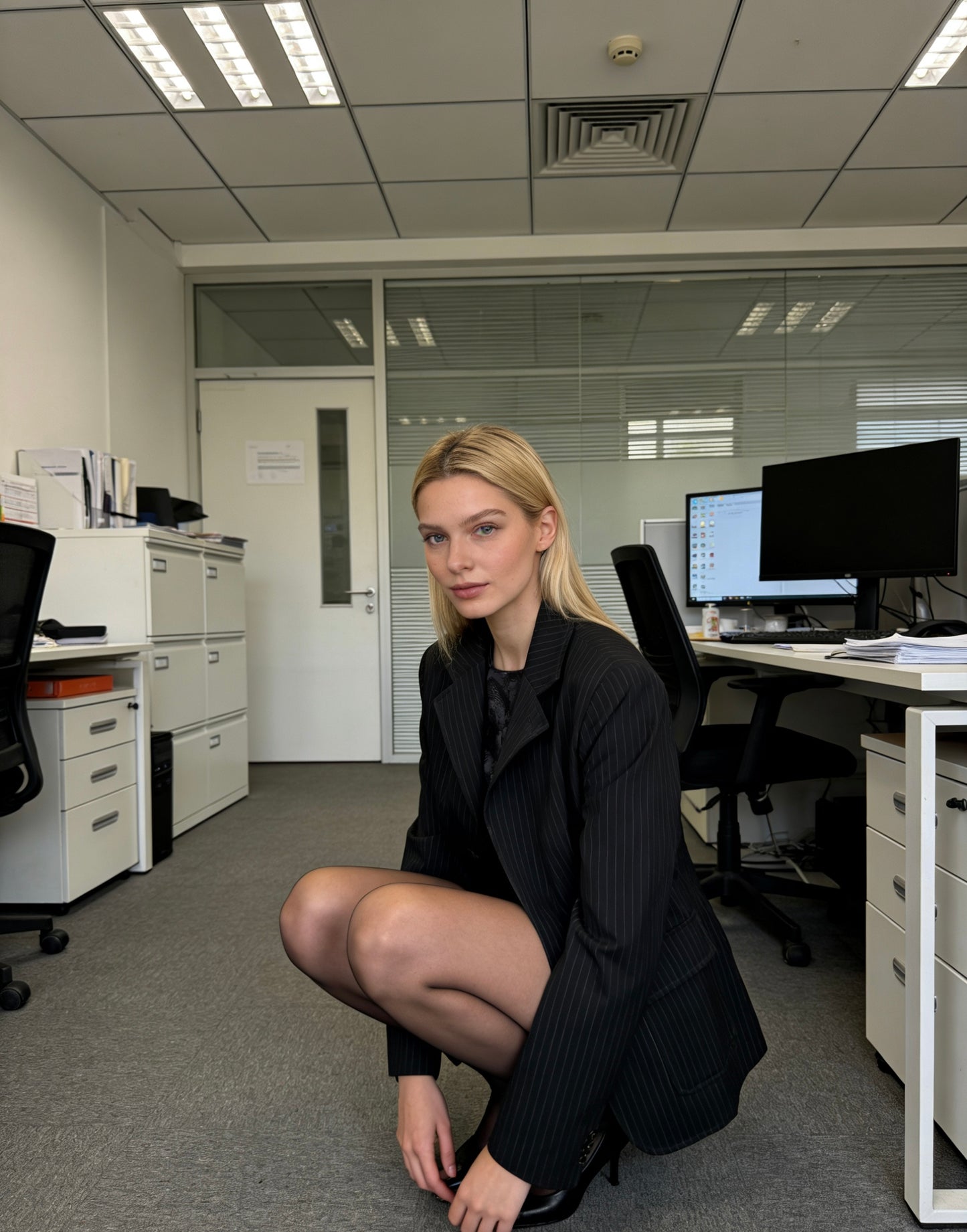 Women’s black pinstripe relaxed-fit single-breasted office blazer