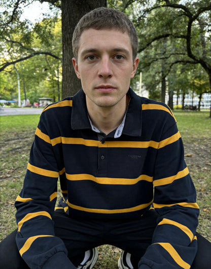Man’s navy blue and gold striped long-sleeve rugby shirt