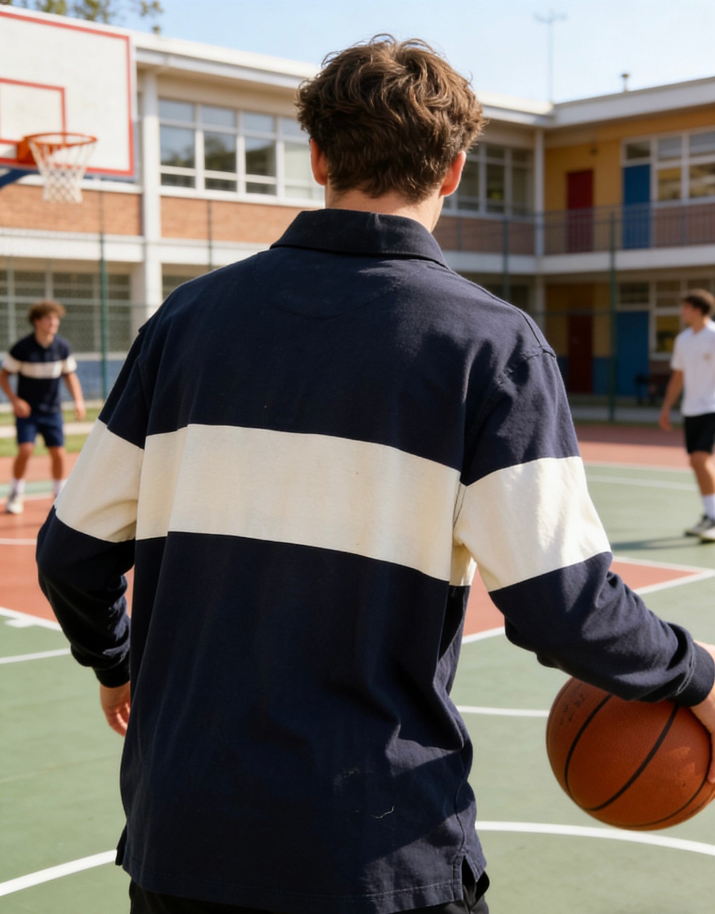 Man’s navy blue and cream color-blocked long-sleeve rugby shirt with small logo embroidery